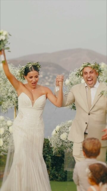 Ariadne and Dimitrios had always dreamed of getting married in a place that held a special meaning to them. When they decided to have their destination wedding in Athens Riviera, they knew it was the perfect choice. They wanted to show the enchanted beauty of Greece to their friends and family who were traveling from Australia to celebrate their special day.As they exchanged vows overlooking the sparkling blue waters of the Aegean Sea, the sun setting behind them painted a picture-perfect backdrop. The ancient ruins of the Acropolis stood majestically in the distance, adding a touch of history and grandeur to their already magical day.Planner: @fevronialuxuryconcepts
Videographer: @vangelis_petalias_filmmaker
Photographer: @vangelisphotography
Music-Lights: @viparties.events
Catering: @catering.dipnosofistirion
Venue: @islandartandtaste
Drums: @erenpercussion
MUA: @marios_stavropoulos_  #
#greece_wedding_videographer
#wedding_cinematography
#wedding_filmmaker
#awarded_wedding_videographer
#athens_wedding_videographer
#greek_islands_wedding_videographer
#wedding_cinema
#wedding_planner_greece
#vangelis_petalias
#petalias
#vogue
#luxury_wedding_videographer
#luxury_wedding_planner
#destination_wedding_greece
#destination_wedding
#athens_riviera_wedding
